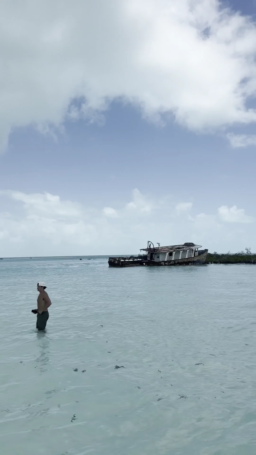 Wading the shallow turquoise bay