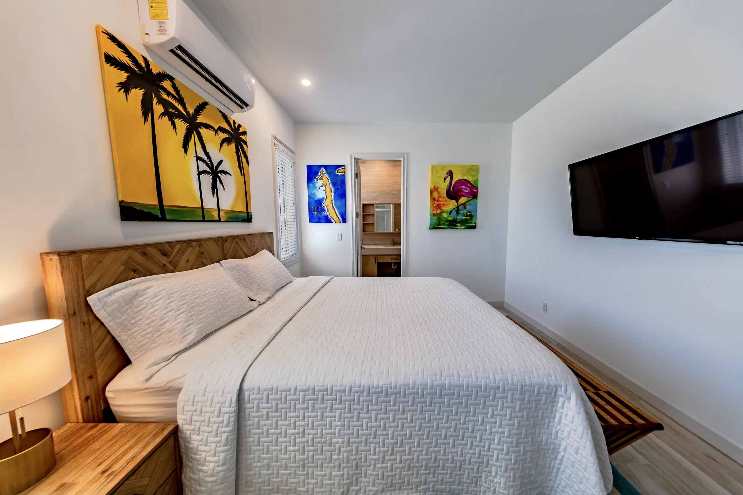 Bedroom with Bahamian art