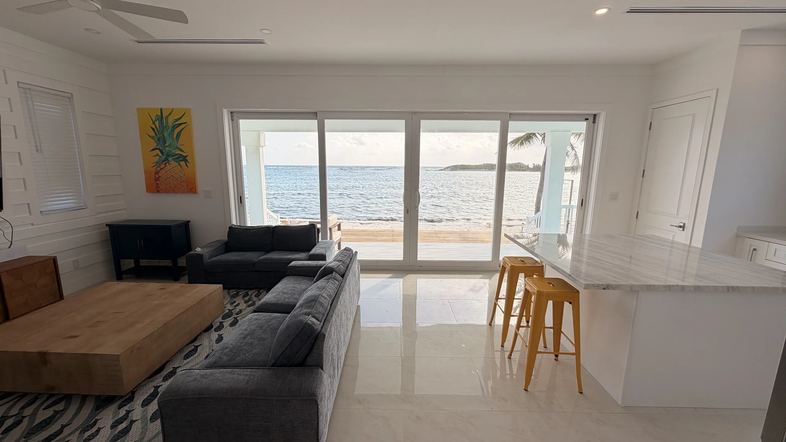 The open living and kitchen of an Oceanfront Villa