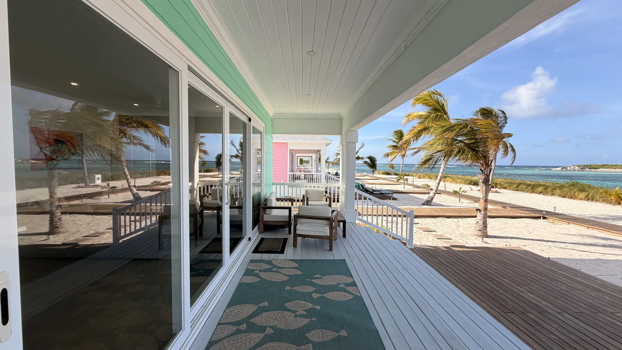 The porch of an oceanfront villa at Coconut Bay